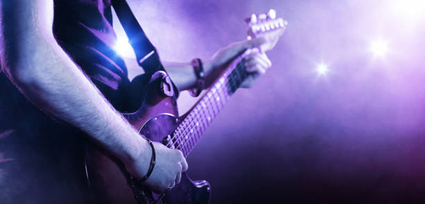 istock Male hands playing a guitar. Close-up 935745822