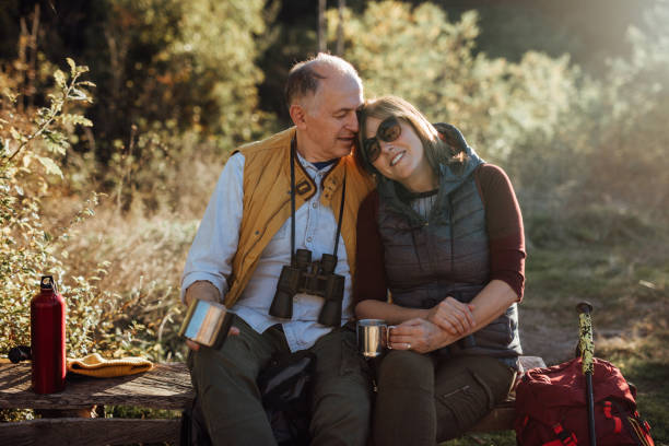istock Senior couple taking break from hiking 935746522