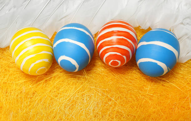 Easter. Colored eggs on a yellow background stock photo