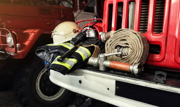 Firemen gear on firetruck such as fire barrel, special clothing, ration, helmet and hydrant