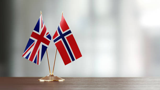istock British And Norwegian Flag Pair On A Desk Over Defocused Background 935760544
