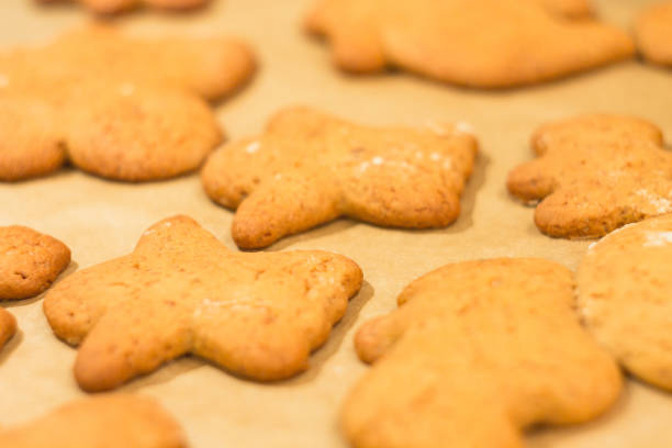 istock Ginger biscuits lie on a baking sheet. Cookies on baking paper 935760904