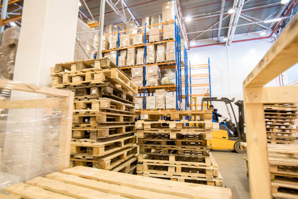istock Wooden pallets stacked in warehouse 935767884