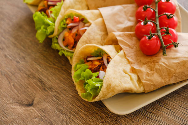 istock Mexican burrito with chicken, pepper and beans 935771068
