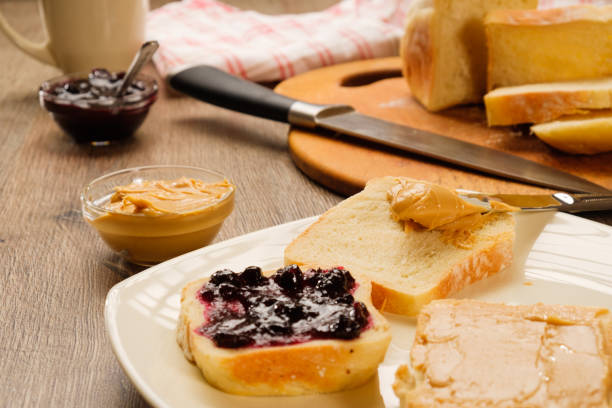 istock peanut butter sandwich with jam on cutting board 935771528