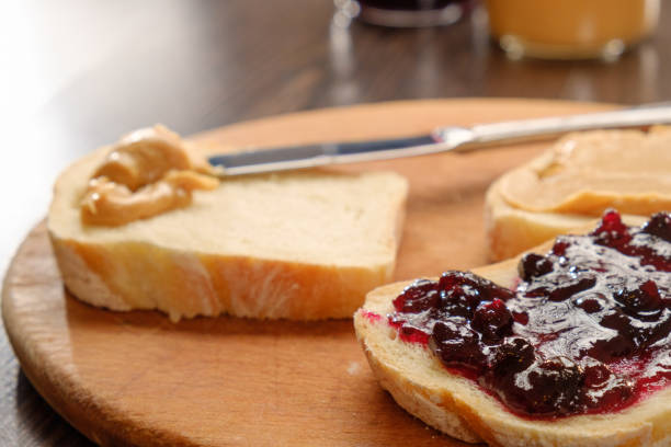 istock peanut butter sandwich with jam on cutting board 935771616