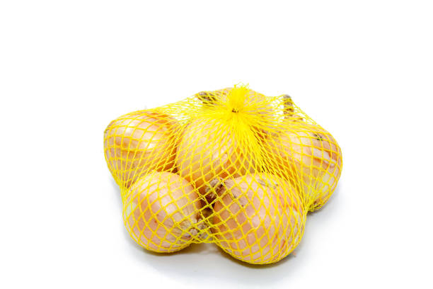 istock Fresh onions in a yellow plastic net 935774058