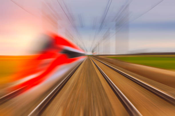 Railroad in motion at sunset. Motion blurred concept image.