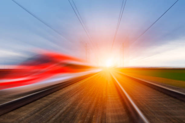 Railroad in motion at sunset. stock photo