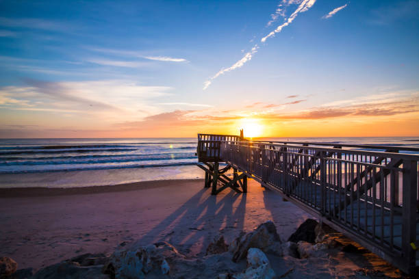 istock Sunrise over a life guard tower in st. augustine 935779826
