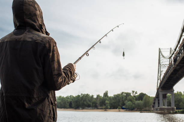 istock Fisherman holding spinning rod with spoon bait 935782092