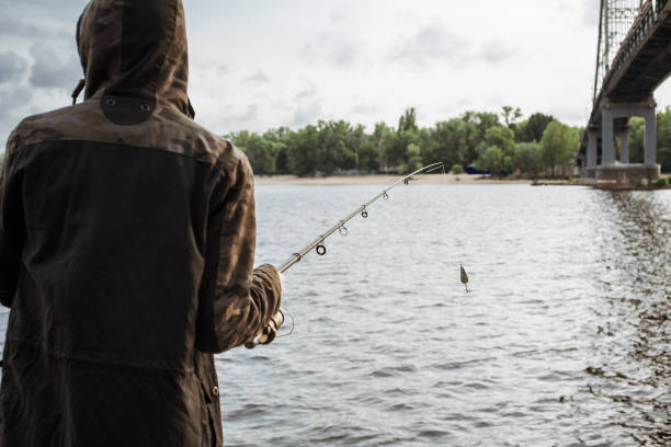 istock Fisherman holding spinning rod with spoon bait 935782276