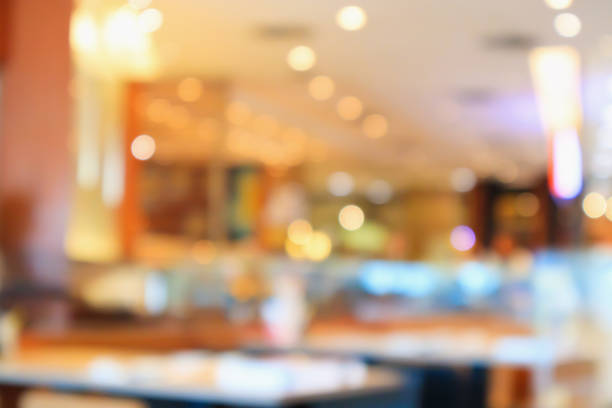 istock abstract blurred cafe restaurant with bokeh lights background 935802656