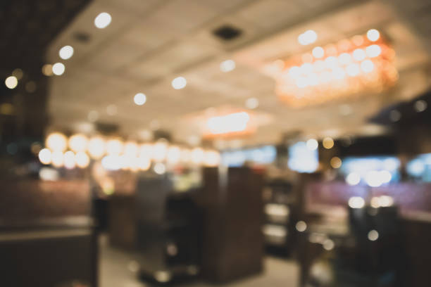 istock abstract blurred cafe restaurant with bokeh lights defocused background 935815836
