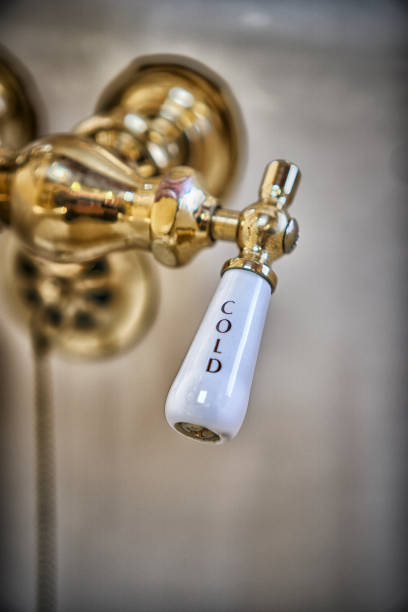 istock COLD: Vintage brass faucet in bathtub 935819324