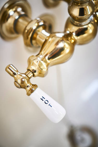 istock HOT: Vintage brass faucet in bathtub 935821636