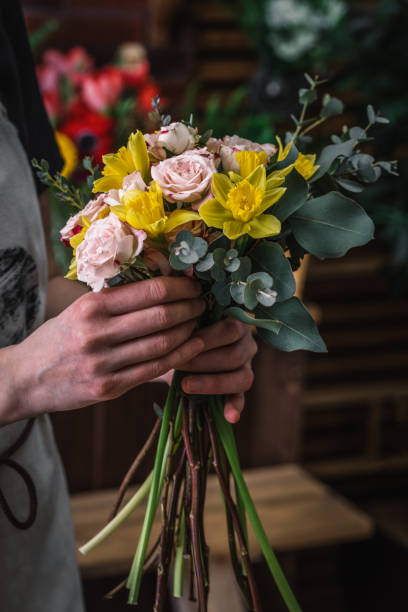 istock Florist making beautiful bouquet 935824344