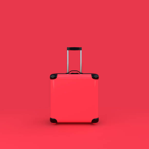 istock Travel suitcase pink color isolated on pink background 935824454