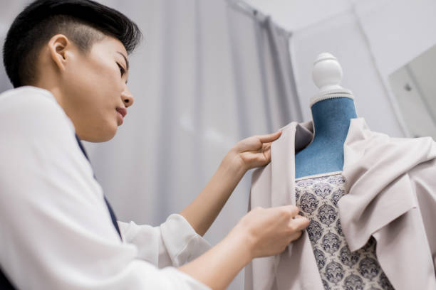 istock Concentrated Asian lady making new dress 935841884