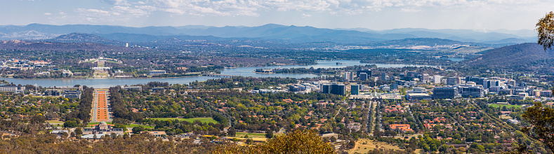 View of Canberra  from Mount Ainslie lookout - ANZAC Parade leading up to the Parliament and modern architecture. ACT, Australia