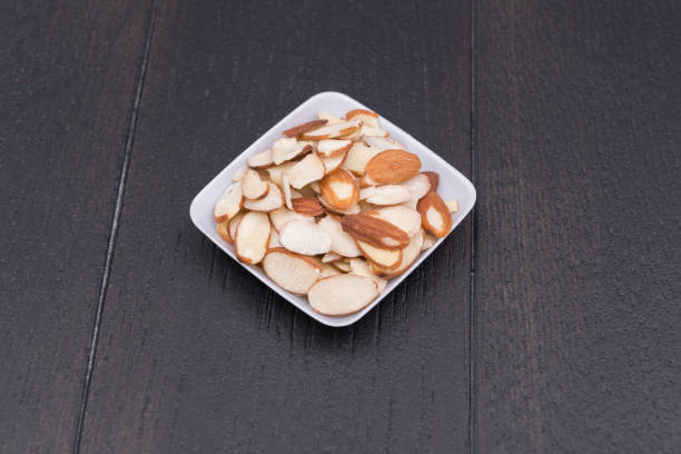Sliced almonds Sliced almonds in bowl almond slivers stock pictures, royalty-free photos & images