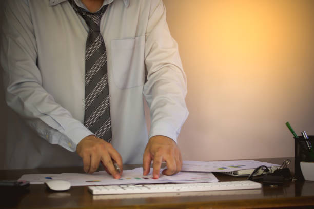 istock Businessman analyzing investment charts with laptop computer on office desk table.Close up.Financial Report Revenue Statistical Accounting Concept. 935874252