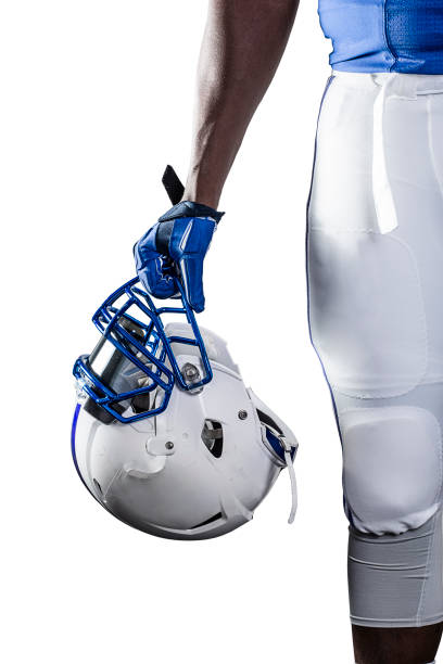 close up view of an american football player holding his helmet - blue helmet imagens e fotografias de stock