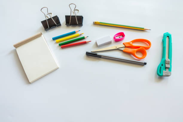 istock White office desk table with Scissors,Cuttere,Eraser and pencil .Top view with copy space.Working desk table concept. 935900898