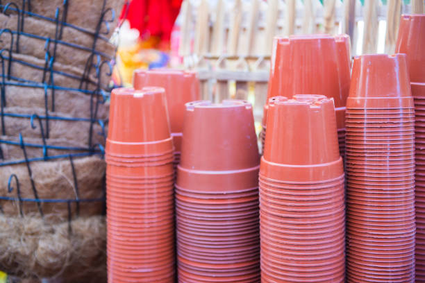 Stack of plastic flower pot for sale in gardening shop