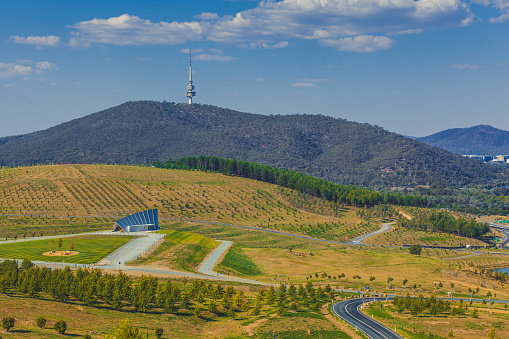 Landscape of  National Arboretum in Canberra, with iconic Telstra tower on Black Mountain. Canberra, ACT, Australia