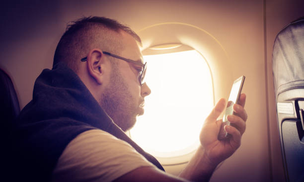istock Businessman travelling by flight using smart phone. 935921878