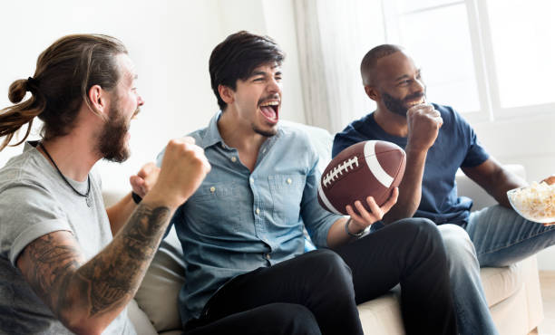 Friends cheering sport league together