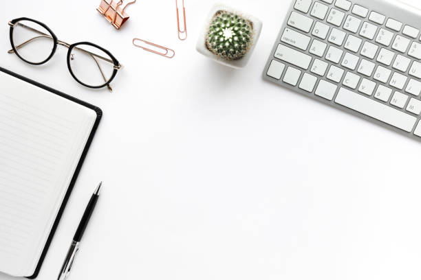 Business table top with mock up office supplies on white background.Flat lay design.