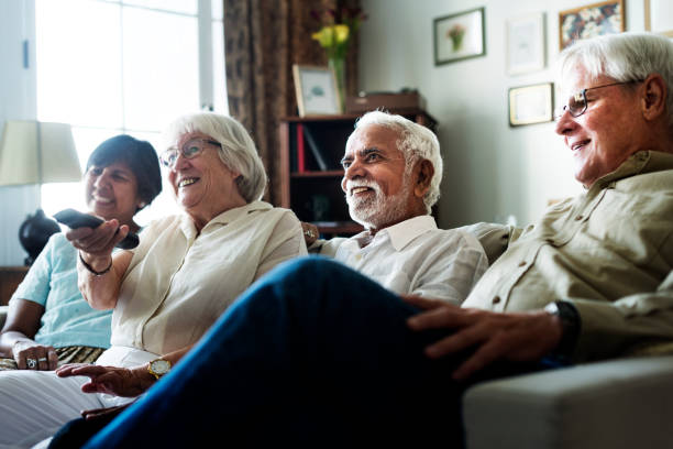 istock Senior people watching television together 935935300