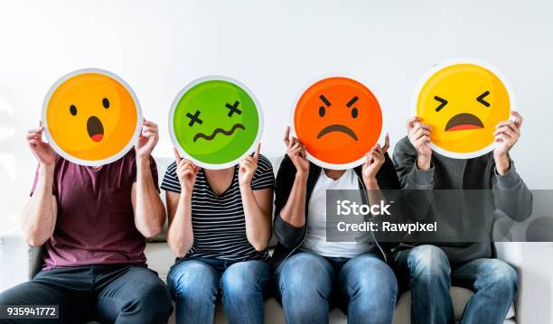 Diverse People Holding Emoticon Stock Photo - Download Image Now - Complaining, Anger, People