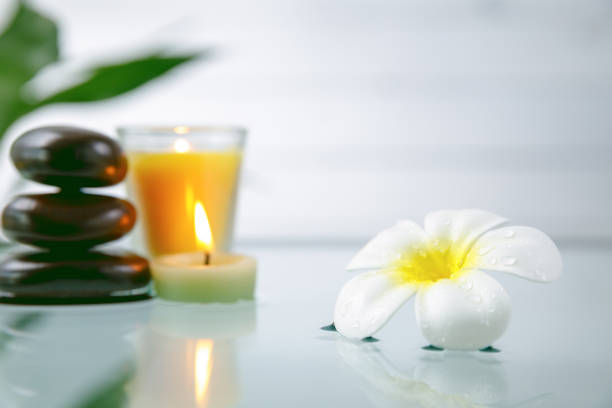 istock spa concept with candle, stone, flower and bamboo, relaxation 935948410