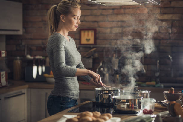 Young Woman Cooking Kitchen Stock Photo 427199368