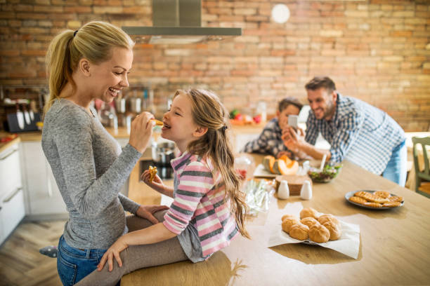 istock Young happy family spending their free time in the kitchen. 935957716