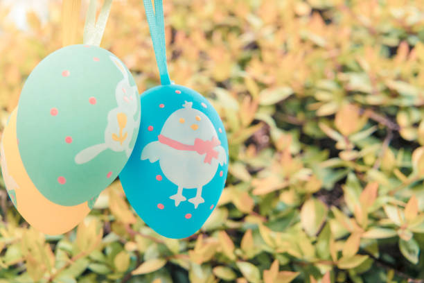 istock colorful easter eggs hanging on the tree, ready for the egg hunter traditional 935958044