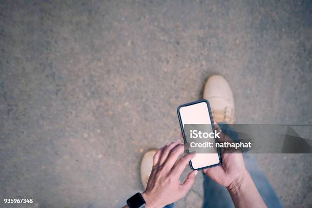 Man Using Smartphone While Walking On The Road Stock Photo - Download Image Now - Telephone, Walking, Aerial View