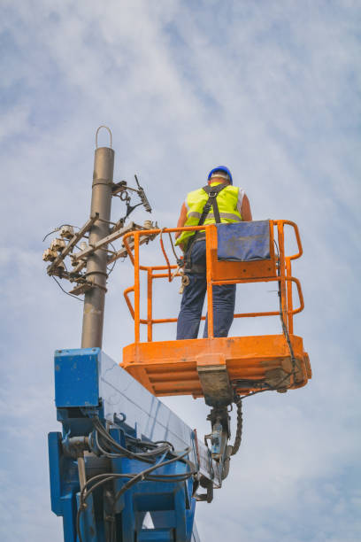 istock Power line worker fixing from the truck basket. 935967812