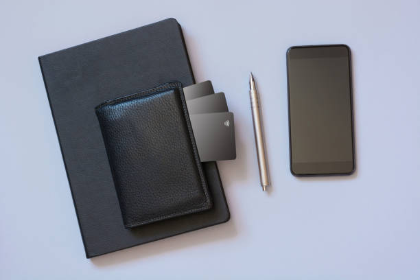 istock Business concept. Storing information about credit cards in a mobile application. Mobile and wallet with credit card. Top view and copy space. 935979006