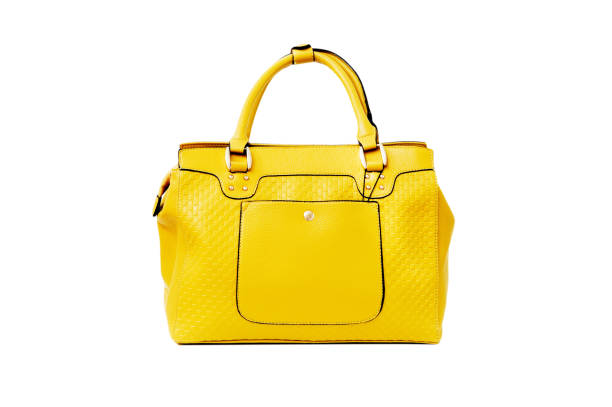 Yellow womanâs bag Yellow womanâs bag, isolated, white background leather clasp stock pictures, royalty-free photos & images