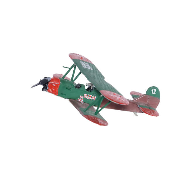 istock Green plastic biplane isolated on the white background 935979298