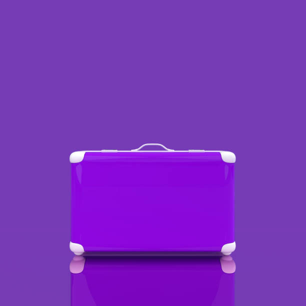 istock Travel suitcase violet color isolated on violet 935979948