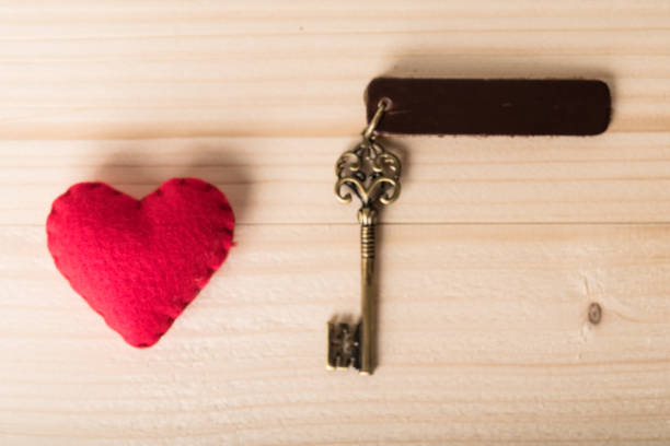 istock Valentines day background. Red heart on wooden table with copy space 935983578