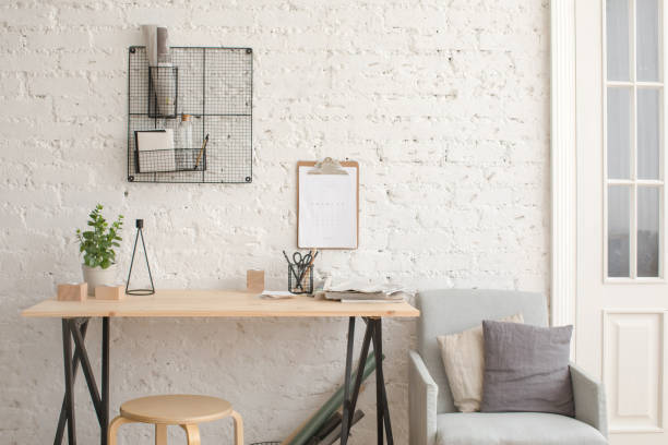 istock Desk with stationery in the white interior Loft 935986234