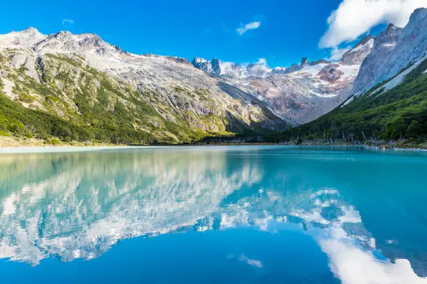 Andes mountains reflecting in lake Laguna Esmeralda near Ushuaia in Tierra del Fuego, Argentina