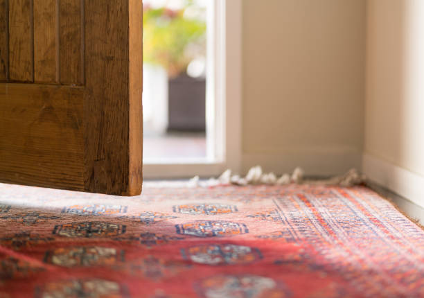 Front Door Low angle view looking out an opening domestic front door rug stock pictures, royalty-free photos & images
