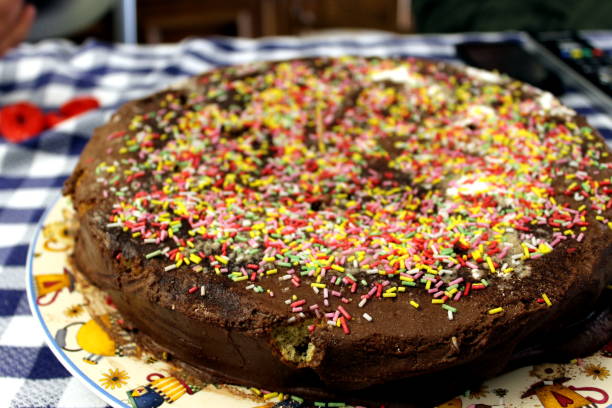 istock Cake or chocolate cake with colored shavings on top 935994456